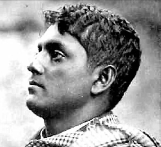 Profile photograph of Jatindranath Mukherjee looking upward, a checked cloth over his shoulder.