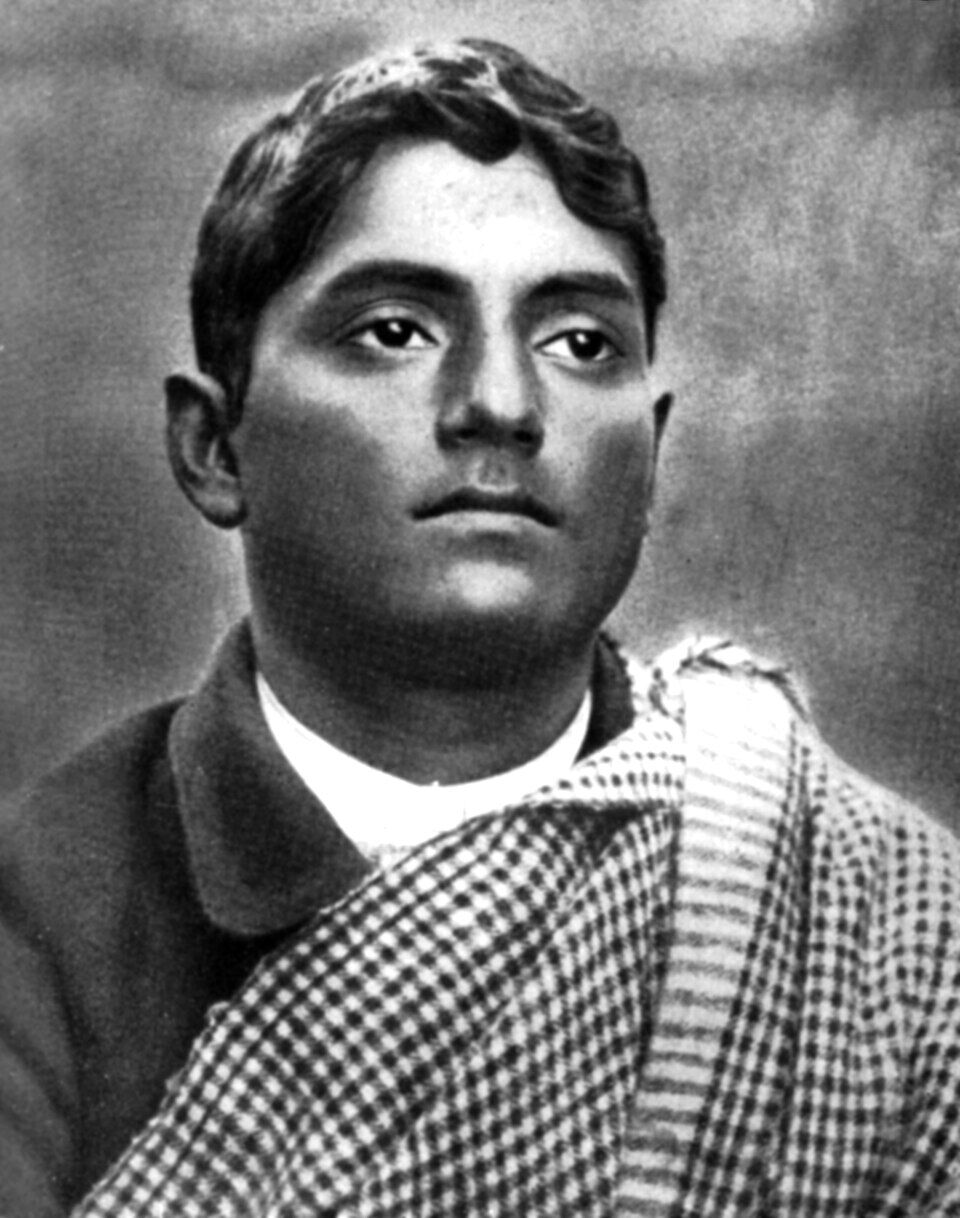 Studio portrait of Jatindranath Mukherjee, known as Bagha Jatin, wearing a checked shawl over a dark jacket and looking directly at the camera.