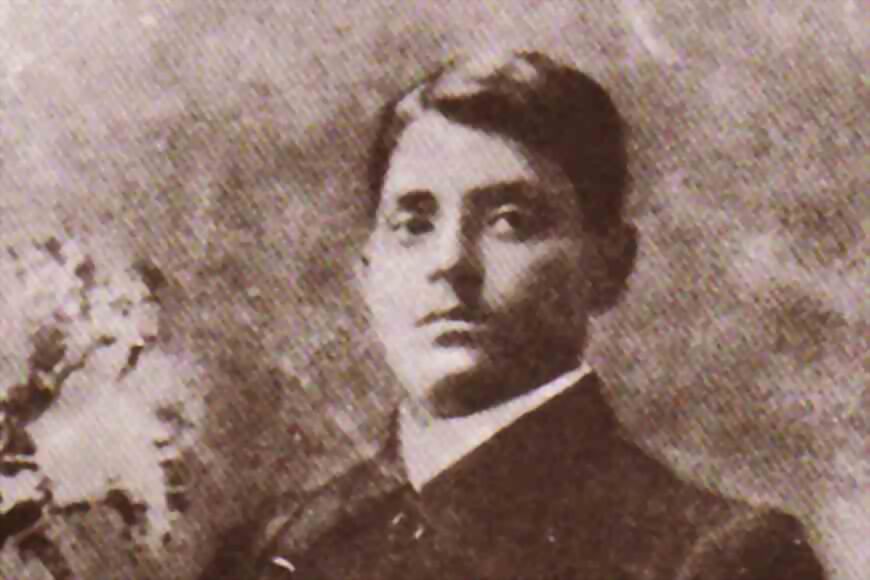 Sepia portrait of a young Jatindranath Mukherjee in a dark jacket.